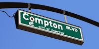 a street sign for compton blvd